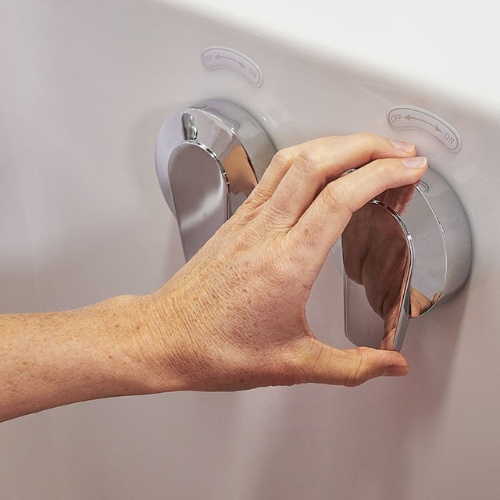 Hand turning chrome hydrotherapy jet control on walk-in tub